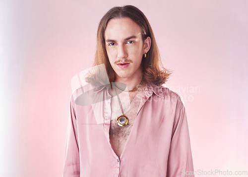Image of Portrait, vintage fashion and gay man with pride and confidence isolated on studio background. Happy, gen z aesthetic and lgbt model with beauty and creative non binary and gender neutral design.