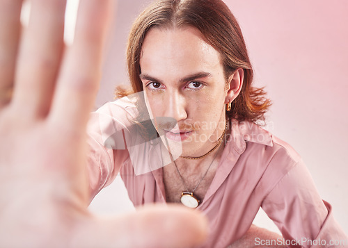 Image of Vintage man, fashion selfie and studio portrait for 70s, hippy or psychedelic aesthetic by pink background. Gen z model, retro clothes or profile picture on social network app for creative influencer