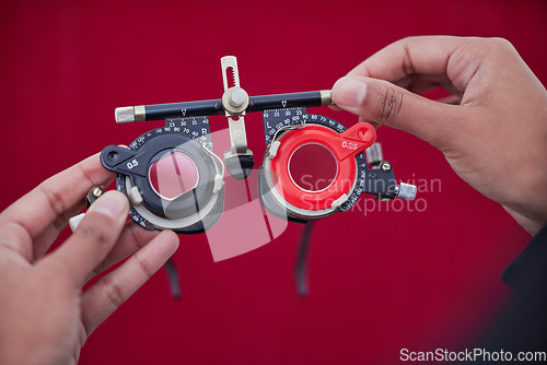 Image of Trial frame, glasses and hands with ophthalmologist tools, vision test with healthcare for eyes and prescription lens. Optometry, eye care and woman optometrist, medicine and chart with measurement