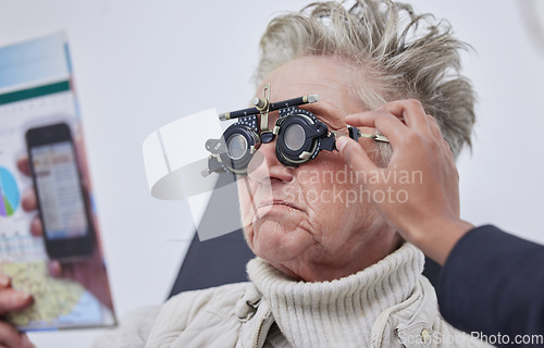 Image of Vision, trial frame and woman for eye exam in optometry clinic for test, eyesight and optical assessment. Ophthalmology, health and elderly patient reading with optician, optometrist and glasses