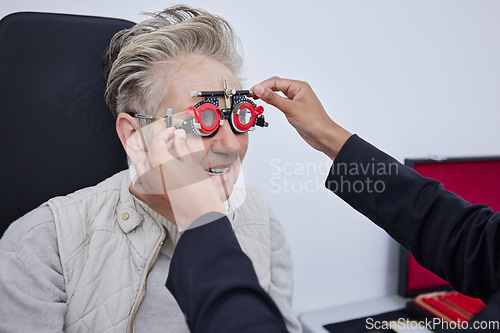 Image of Eye exam, frame and senior woman with optometrist in clinic for vision, eyesight and optical assessment. Ophthalmology, healthcare and optician with trial glasses, optometry and medical tool for eyes