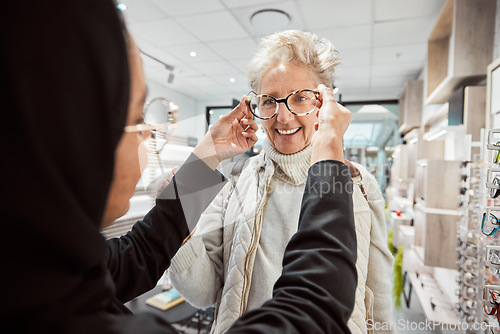 Image of Eyewear, vision and optometry with a senior woman in an optician office for prescription lenses. Glasses, eyesight and fashion with a mature customer buying new frame spectacles at the optometrist