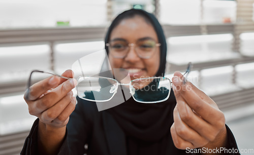 Image of Decision, portrait and Muslim woman with glasses for vision, help and shopping at a store. Optometry, retail and Islamic optician helping with eyewear fitting, consultation and eye care frame