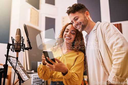 Image of Man, woman or phone in recording studio for song lyrics, podcast ideas or album cover art in production booth. Smile, happy or musician on mobile technology for friends, singer or media collaboration