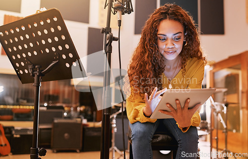 Image of Musician, woman or tablet for song writing in recording studio for album, night performance or radio industry. Smile, happy or singer on technology for artist singing lyrics, production or research