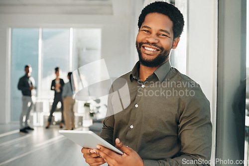 Image of Portrait, digital tablet and black man in office happy, smile and empowered, ambition and mindset. Face and business man or ceo at startup company for management or online project at workplace