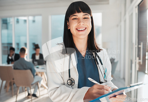 Image of Doctor, woman and portrait smile with checklist in hospital for research or wellness report. Healthcare clinic, planning and happy female medical professional laughing with clipboard to write notes.