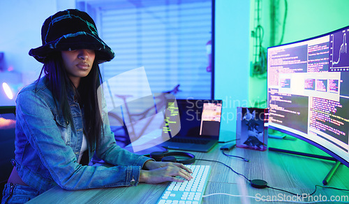 Image of Programming, software and data with a black woman developer working in a neon office for information technology. Computer, cyber security and database with a female programmer typing code for an app