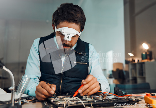 Image of Electric meter, motherboard and IT professional or engineer repair chip or electronic device in a workshop or shop. Person, man and guy fixing hardware of a computer for technology in a lab