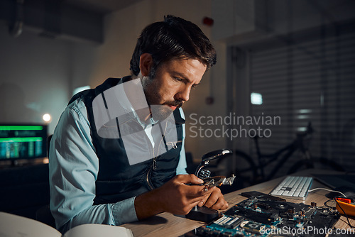 Image of Man, circuit and it repair workshop in night for maintenance, computer tech or industry with focus. Technician, motherboard and information technology in dark with electronics, engineering and tools