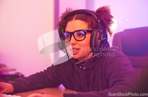 Image of Video games, young girl and headset in home for esports, online rpg and virtual competition. Female gamer, computer streamer and gaming with headphones in neon lighting, live streaming tech and gen z