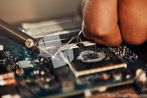 Image of Hands, motherboard soldering and man repair hardware circuit, electronics or semiconductor. CPU system maintenance, service industry closeup or information technology worker fix microchip in tech lab