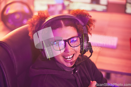 Image of Happy streamer portrait, video game and girl with headphones in home of esports, online games or virtual media. Excited young female, gamer and gaming on headset in neon lighting, gen z or technology