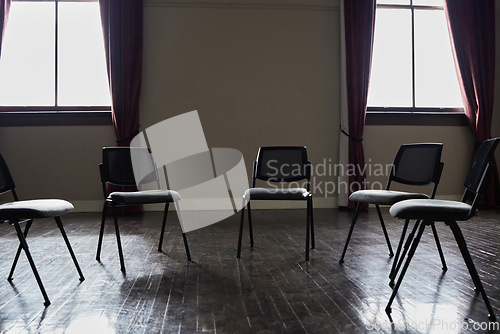 Image of Group therapy, mental health or circle chairs in empty room, clinic or asylum building for trauma, ptsd or anxiety counselling. Furniture, support or community psychology counseling for help meeting