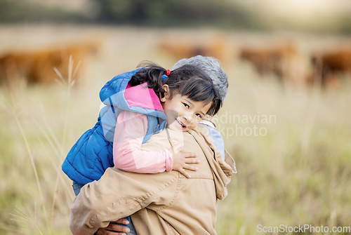 Image of Grandmother carrying girl, field portrait and family farm, grass and bonding together with love outdoor. Old woman, child and hug support in countryside, care and happiness in nature with landscape