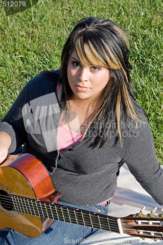 Image of Girl Playing a Guitar