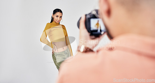 Image of Camera, photographer and photography with woman fashion model in studio for creative, advertising and image. Media, backstage and professional man with girl and equipment for photoshoot capture