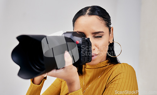 Image of Black woman, photographer and camera for photoshoot, digital agency and production process. Photography, African American female and artist with device to shoot in studio, creative media and employee