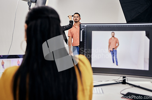 Image of Woman, photographer and studio with man, makeup and camera for vision, fashion and magazine. Photography expert girl, focus and workspace with background, model and photoshoot for clothes design blog