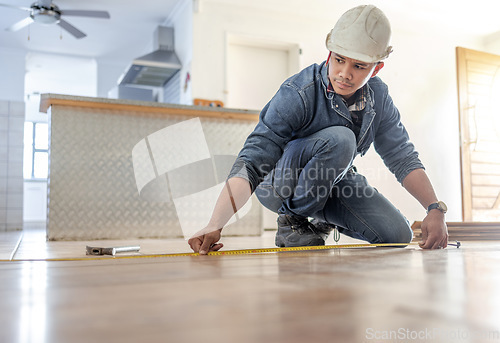 Image of Man, carpenter and measure floor with tape, home interior and buildings maintenance. Builder, construction and handyman measuring flooring on ground, wood board house and property renovation tools