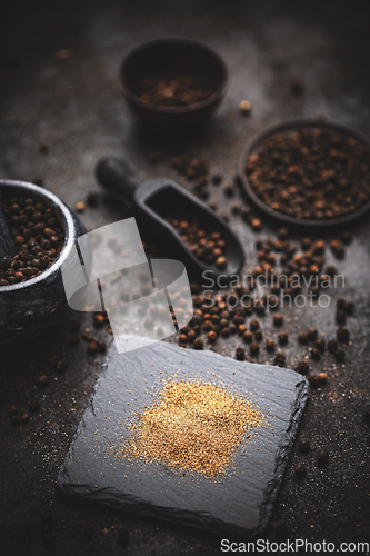 Image of Whole and ground black peppercorns