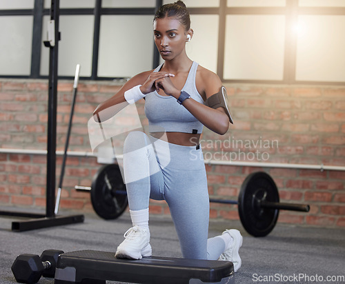 Image of Fitness, lunges or woman at gym training, exercise or body workout for powerful legs or strong muscles. Focus, resilience or healthy Indian girl athlete exercising with balance in a wellness club