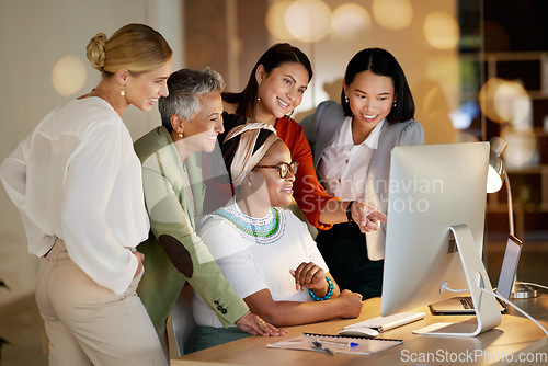 Image of Computer, management and a business woman with her team, working on a deal in the office at night. Collaboration, diversity and coaching with a senior female manager training her staff at work