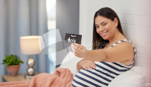 Image of Pregnant, woman portrait and ultrasound in hand for baby development or growth. Happy person show fetus scan photograph in bed for gynecology, pregnancy update and health or wellness in home bedroom