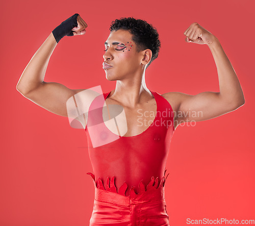 Image of LGBTQ, flexing and empowerment of gay man or nonbinary person with fashion isolated in studio red background. Strength, queer and model with style and beauty in the gen z and LGBT community pride