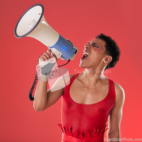 Image of Anger, gay and a man with a megaphone for protest isolated on a red background in a studio. Lgbt, freedom and person shouting and talking into a speaker for gen z rights and voice or riot on backdrop