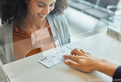 Image of Travel, ticket and airport with black woman at check in desk for. registration, vacation and boarding flight. Documents, passport and departure with passenger at counter for journey and holiday