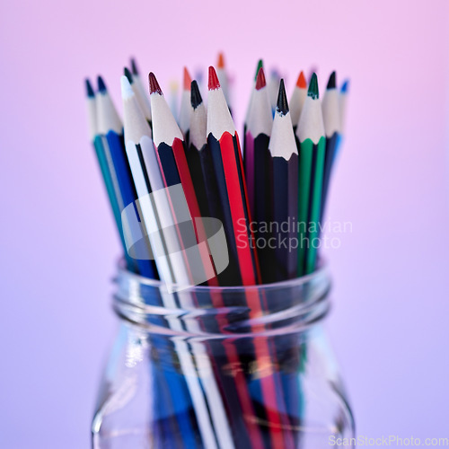 Image of Creativity, art and drawing pencil container for school coloring stationery zoom. Closeup of a glass jar with color pencils in purple gradient studio background for creative education.