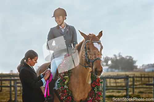 Image of Woman, horse and winner of equestrian competition with ribbon award for sports achievement. Athlete person on animal for horseback riding, race and training for badge prize with pride in countryside