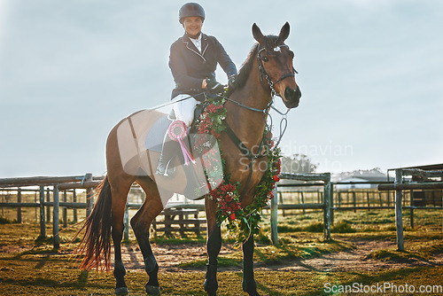 Image of Woman, equestrian winner portrait and pet horse in green countryside and field. Animal, young jockey win an award at competition or show of a rider and athlete with outdoor with sports with horses