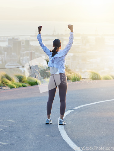 Image of Run celebration, woman winner and fitness goal of a excited and happy runner on a road. Cityscape, freedom and motivation of a female athlete back feeling exercise success from running and training