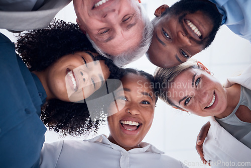 Image of Portrait, below and happy business people in group or circle for teamwork, team building and collaboration. Face of diversity employees, worker and professional community smile together in solidarity