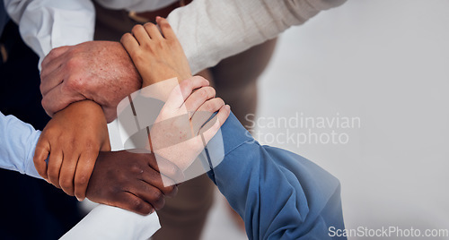 Image of Office, teamwork and diversity, hands together in circle for team building, collaboration and motivation at startup. Men, women and employees mission in solidarity for business growth or development.