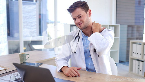 Image of Man, doctor and laptop with neck pain, ache or tension sitting by office desk in stress or discomfort at hospital. Healthcare male suffering holding painful area from work injury, bruise or sore