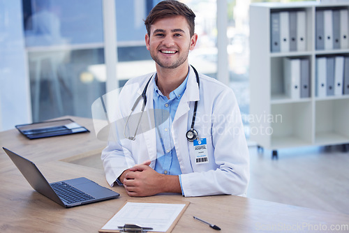 Image of Man, doctor and portrait smile with laptop for healthcare, Telehealth or research at office desk. Happy male medical professional smiling by computer for medicare innovation or development at clinic