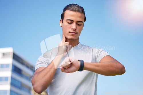 Image of Fitness, running and pulse with man and watch check for training, heart rate and wellness app. Workout, exercise and health with runner in jogging in city for monitoring performance, steps or results