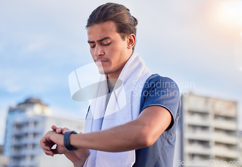 Image of Fitness, smartwatch and man checking running, health and cardio progress while training in a city. Digital, heart and pulse tracker for guy runner outdoor for performance, monitor and exercise app