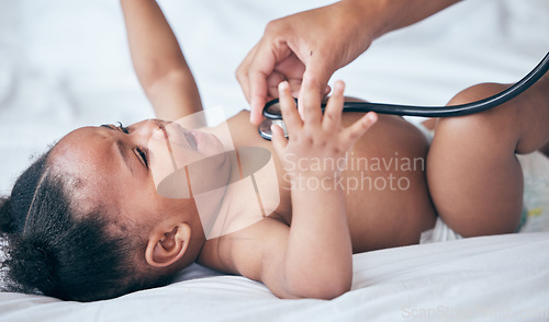 Image of Baby, health and pediatrician hand, stethoscope and listen to heart, medical checkup and childhood development. Healthcare exam, people at clinic and growth with black girl infant and consultation