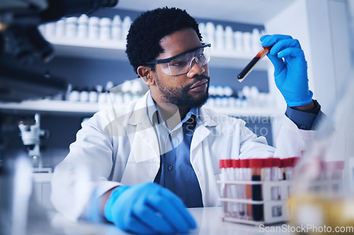 Image of Science, blood and black man in laboratory with sample for research, medical exam and investigation. Healthcare, pharmaceutical and male scientist with test tube for dna study, cure and rna analysis