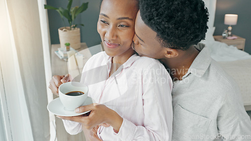 Image of Happy couple, morning coffee and hug to show love and care while looking out hotel, apartment or bedroom window on honeymoon vacation. Happy black man and woman showing commitment and romance