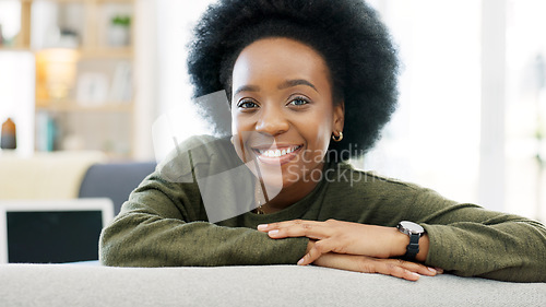 Image of Face of a happy afro woman relaxing indoors on the weekend. Beautiful, cheerful and carefree African American girl having a stressless day at home relaxing in her modern bright living room apartment
