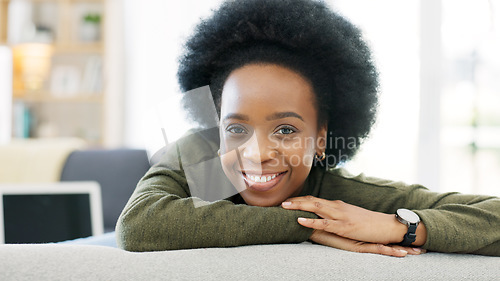 Image of Face of a happy afro woman relaxing indoors on the weekend. Beautiful, cheerful and carefree African American girl having a stressless day at home relaxing in her modern bright living room apartment