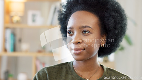 Image of Face of a happy afro woman relaxing indoors on the weekend. Beautiful, cheerful and carefree African American girl having a stressless day at home relaxing in her modern bright living room apartment