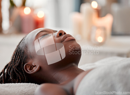 Image of Black woman sleep, peace and luxury spa face treatment of young female ready for facial. Skincare, beauty and wellness clinic candles with client feeling calm and zen before massage or chemical peel