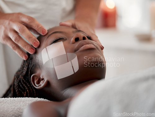 Image of Black woman, face massage and luxury spa treatment of a young female ready for facial. Skincare, beauty and wellness clinic with client feeling calm and zen for collagen and chemical peel at salon