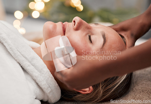 Image of Beauty, gua sha and woman getting a facial massage for wellness, health and self care at a spa. Skincare, cosmetic and calm young female doing a luxury face treatment with rose quartz at a zen salon.